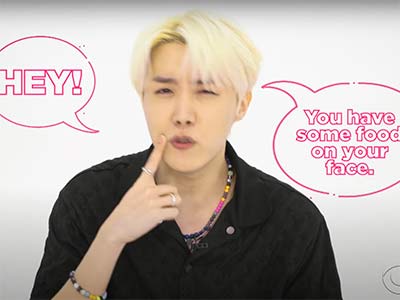 BTS hand gesture "something on your face"